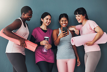 Image showing Fitness, friends and funny meme on smartphone, online comedy while at gym with women at yoga and exercise. Workout together, diversity and social media with connection and health on studio background