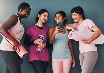 Image showing Fitness friends, smartphone and funny meme on social media, communication and workout group, women at yoga together. Exercise mat, mobile app and connection with comedy online, laugh and health