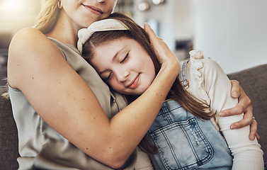 Image showing Love, hug or mother with a girl to relax as a family in living room bonding in Australia for childcare. Hugging, smile or mom with a happy calm kid enjoying quality time on a peaceful holiday at home