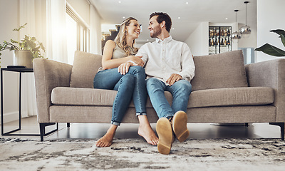 Image showing Love, comfy and couple on the sofa to relax with a smile and gratitude in living room. Happiness, laughing and happy man and woman comfortable on the couch for peace, conversation and affection