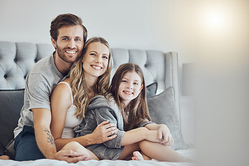 Image showing Portrait, mother or father hugging a girl to relax as a happy family in bedroom bonding in Australia with love or care. Morning, embracing or parents smile with kid enjoying quality time on holiday