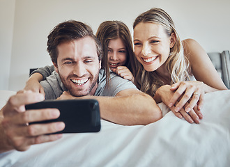 Image showing Portrait, relax or parents take a selfie with a girl as a happy family in house bedroom bonding in Berlin. Mother, father or child relaxing together enjoying quality time or taking pictures at home