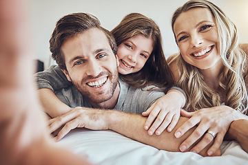 Image showing Portrait, smile or parents take a selfie with a girl as a happy family in house bedroom bonding in Berlin. Mother, father or child relaxing together enjoying quality time or taking pictures at home