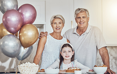 Image showing Portrait, grandparents or girl in celebration of a happy birthday in house party or kitchen with popcorn or cake. Grandmother, old man or child bonding with love or care in family home to celebrate