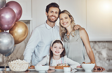 Image showing Portrait, family or girl in celebration of a happy birthday in a house party or kitchen with a smile popcorn or cake. Mother, dad or child bonding or hugging with love at home to celebrate together