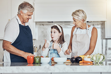 Image showing Thumbs up, grandparents or child cooking in kitchen as a happy family in a house with healthy vegetables at dinner. Grandmother, old man or girl with a yes, like or good hand sign helping with diet