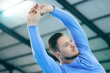 Image showing Man, fitness and stretching arms for muscle, growth or development for sports, exercise and goal. Wellness, training and healthy strong body for young athlete with focus mindset, vision or motivation