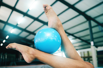 Image showing Feet, gymnastics and woman with ball for competition, practice or event training. Closeup, sports and barefoot female gymnast balance equipment with agility, exercise and performance in olympic arena