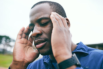 Image showing Black man, stress and headache after exercise, workout or training practice outdoors. Sports wellness, fitness and mental health of tired male athlete with pain, burnout or migraine after running.