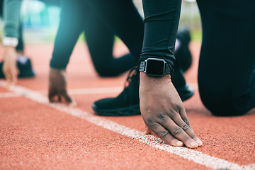 Image showing Athlete, runner and fitness person at start of a race on a sports track for exercise, workout or motivation. Running, sprint and closeup of man ready for training as wellness, competition and health