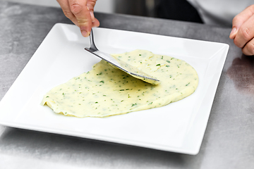 Image showing Chef add mashed potatoes on plate