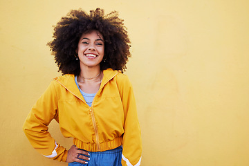 Image showing Portrait, fashion and mockup with an afro black woman in studio on a yellow background for style. Trendy, hair and mock up with an attractive young female posing alone on product placement space