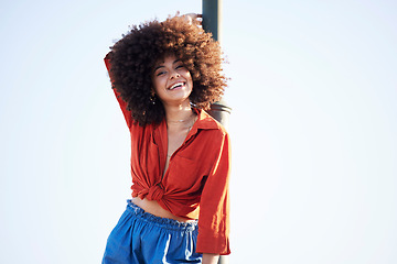 Image showing Woman, happy and outdoor portrait for fashion on a blue sky background with summer mock up space. Face of beauty model person with natural hair, happiness and unique style for freedom mindset