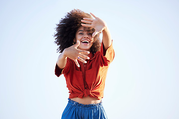 Image showing Woman, portrait and hands over face outdoor for fashion on a blue sky background with summer mockup space. Beauty model person with natural hair, happy smile and unique style for freedom mindset