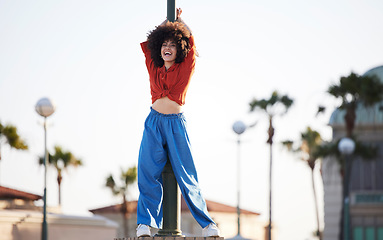 Image showing Fashion, dancer and black woman in urban city with energy, excited and freedom of gen z youth in streetwear. Natural hair, afro and young person or model in trendy clothes for outdoor hip hop style