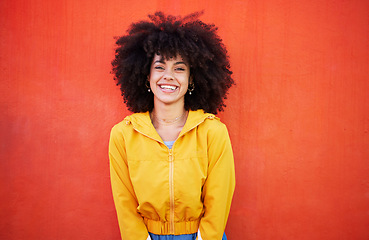 Image showing Portrait of happy woman with natural hairstyle on red background, headshot of model and red copy space. Confident young person with smile expression, curly hair and aesthetic fashion on studio wall