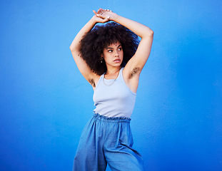 Image showing Body positivity, empowerment and confident woman with hair isolated on a blue background. Beauty, natural and African girl showing armpit with confidence, feminism and attractive on a backdrop