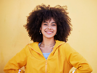 Image showing Portrait, fashion and happy with an afro black woman in studio on a yellow background for style. Trendy, hair and smile with an attractive young female posing alone on product placement space