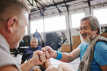 Image showing Fitness, gym and men with fist bump for senior support, personal trainer goals and exercise progress. Japanese or asian elderly person with teamwork, achievement and success hand sign for training