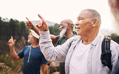 Image showing Hiking, old men and pointing with view, nature and reunion on summer vacation, bonding and conversation. Hikers, mature males and senior friends on getaway outdoor, quality time and talking on trip