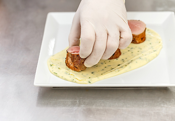 Image showing Chef garnishing his dish