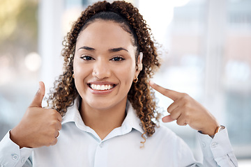 Image showing Black woman, portrait smile and thumbs up for hearing aid, auditory treatment or audiologist at clinic. Happy African American female smiling showing hand thumb emoji for listening success or thanks