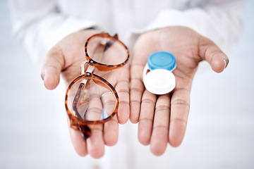 Image showing Eye care, choice with glasses or contact lenses in hands, closeup and vision with healthcare for eyes. Prescription lens, person with frame and plastic container, optometry with optician and health