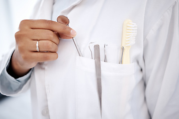 Image showing Dentist, healthcare and hands with tools for dental wellness, teeth whitening and oral care. Dentistry, medical clinic and orthodontist with metal equipment for tooth hygiene, surgery and cleaning