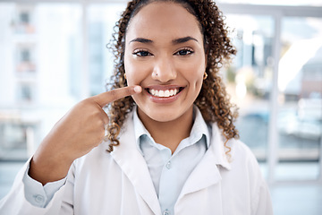 Image showing Portrait of black woman pointing to teeth whitening results, dentist medical and mouth healthcare in hospital. Professional dental doctor with tooth cleaning services and happy face in USA clinic