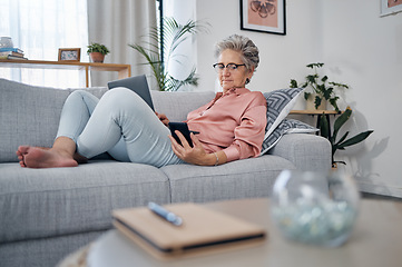 Image showing Retirement, old woman on sofa and smartphone for connection, social media and chatting. Female senior citizen, elderly lady and laptop to check pension fund, investments and relax on couch in lounge