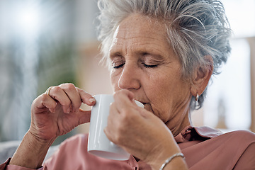 Image showing Elderly woman, sofa and coffee to relax with drink for peace, quiet and me time to start morning in house. Senior lady, couch and tea for happiness, thinking and memory from aroma in home living room