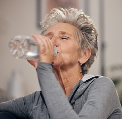 Image showing Drinking water, fitness and retirement with a senior woman in her home for wellness or hydration. Exercise, drink or thirsty with a mature female training in her house during a workout to stay active