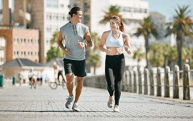 Image showing Couple, running and training together in the city for exercise, workout or cardio routine in Cape Town. Happy man and woman runner in fitness, walk or jog for healthy wellness or exercising outside