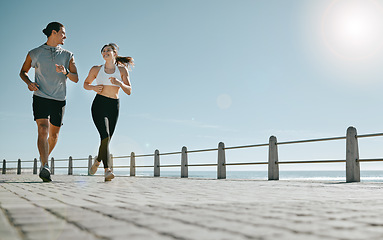 Image showing Couple, fitness and running by beach on mockup for exercise, workout or cardio routine together. Happy man and woman runner taking a walk or jog for healthy wellness or exercising in Cape Town