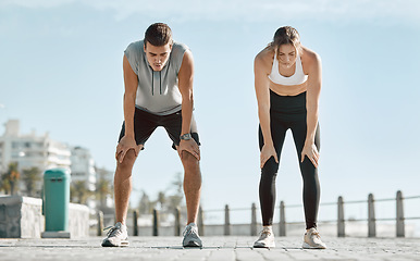 Image showing Fitness, exercise and tired couple with blue sky to rest for health and wellness outdoor. Man and woman for city workout, cardio performance and healthy lifestyle for body fatigue, breathe and energy