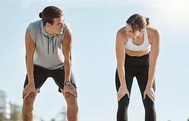 Image showing Tired couple, fitness and exercise on blue sky mockup space for health and wellness outdoor. Man and woman in nature for workout, breath and healthy lifestyle for body fatigue, support and motivation