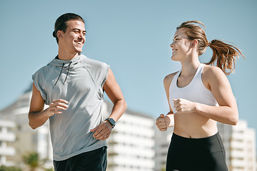 Image showing Couple, fitness and smile running in the city for exercise, workout or cardio routine together in Cape Town. Happy man and woman runner taking a walk or jog for healthy wellness or exercising outside