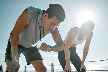 Image showing Fitness, tired couple and running time on blue sky for health and wellness outdoor. Man and woman in nature for workout performance and healthy lifestyle for body fatigue with lens flare and progress