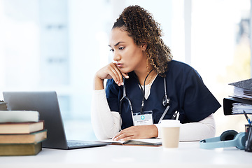 Image showing Healthcare, laptop and research with a woman nurse reading information in a hospital for diagnosis. Medical, insurance and education with a female med student working in a clinic for data analysis