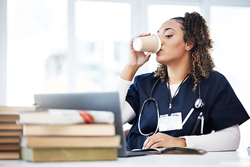 Image showing Medical student, laptop or drinking coffee in hospital studying, education books research or wellness learning school. Thinking, nurse or healthcare woman and drink, technology or medicine internship