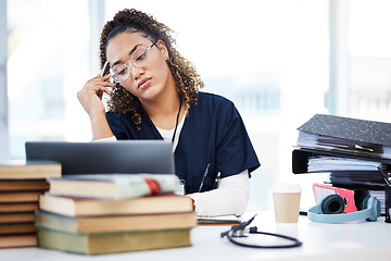 Image showing Nurse, tired or stress in hospital education, wellness books study or research laptop learning in medicine scholarship. Thinking, woman or burnout for healthcare worker, student or anxiety internship