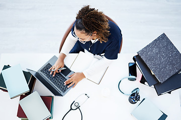 Image showing Top view, laptop or nurse in hospital research, education studying or university books learning for medical student. Above, woman or healthcare worker on technology in scholarship medicine internship