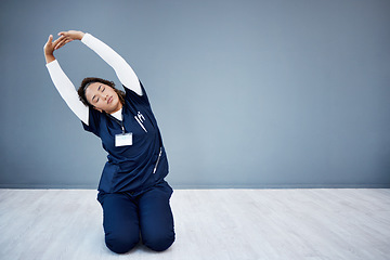 Image showing Tired nurse, stretching or arms up on hospital mockup, clinic backdrop or wall mock up in wellness mobility, joint support or healthcare. Doctor, woman or medical physiotherapist and hands in warm up