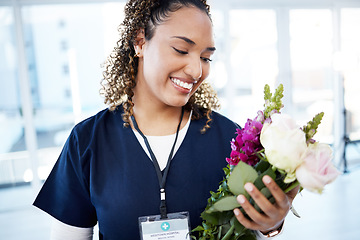 Image showing Achievement, celebration and a doctor with flowers at a hospital for a promotion and gift for work. Care, happy and female nurse with a bouquet as a present for promotion in healthcare nursing job