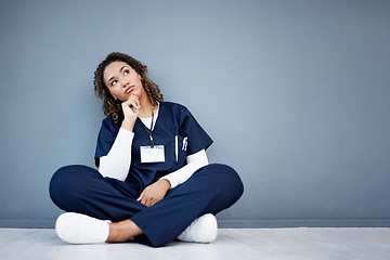 Image showing Nurse, sitting or thinking of hospital treatment, medicine innovation or surgery planning on mock up wall. Doctor, woman or healthcare worker and ideas, vision or decision for wellness life insurance