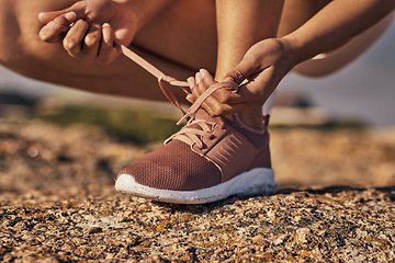 Image showing Hands, fitness and tie shoes in nature to start running, workout or training. Sports, wellness and female or woman tying sneaker laces or footwear to get ready for exercising, cardio or jog outdoors.