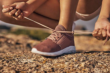 Image showing Fitness, hands and tie shoes in nature to start running, workout or training. Sports, wellness and female or woman tying sneaker laces or footwear to get ready for exercising, cardio or jog outdoors.