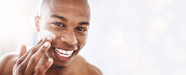 Image showing Black man, skincare portrait and cream by mockup space, smile or happy for cosmetic beauty by blurred background. African gen z model, skin health and natural glow with product placement mock up