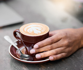 Image showing Latte cup, hands on table with art for customer services, restaurant creativity and hospitality industry with inspiration. Cafe shop with person hand holding espresso, cappuccino or coffee drink