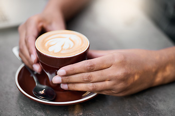 Image showing Coffee cup, hands on table with art for customer services, restaurant creativity and hospitality industry with inspiration. Cafe shop with person hand holding espresso, cappuccino or latte drink